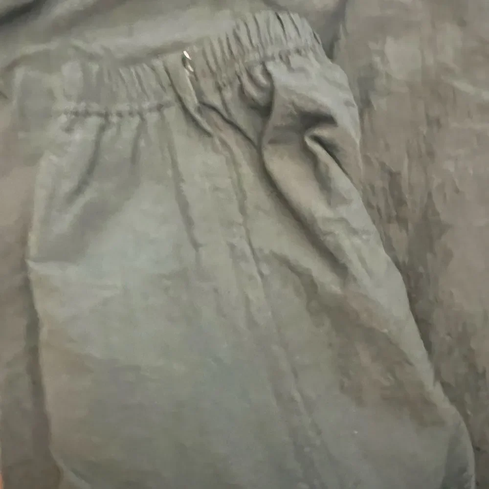 Men’s Vintage Reebok Nylon ankle zip track pants.